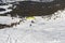 Paraglider taking off from a snowy alpine slope