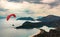 Paraglider tandem flying over the Oludeniz Beach and bay at idyllic atmosphere. Oludeniz, Fethiye, Turkey. Lycian way.