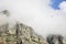 Paragliders floating in clouds over Table Mountain, Cape Town.