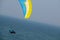 paragliders fly along the steep coast of the Baltic Sea