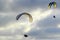 Paragliders flying into the clouds