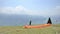 Paragliders landing and taking off from mountain slope near Locarno