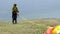 Paragliders landing and taking off from mountain slope near Locarno