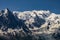 Paragliders looking for thermals amongst the snow caps of the Monte Blanc Massif, Chamonix,