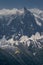 Paragliders looking for thermals amongst the snow caps of the Monte Blanc Massif, Chamonix,