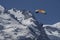 Paragliders looking for thermals amongst the snow caps of the Monte Blanc Massif, Chamonix