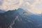 Paragliders over Swiss Alps in summer. Bad weather, risk, danger concept. Extreme sports, adventure lifestyle. Switzerland. Tandem