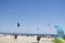 Paragliders and parasols of different colors on a beach in Andalusia in Spain