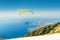 Paragliders start from Babadag mountain and fly to the coast of the famous resort of Oludeniz. Concept of air sports and