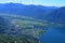 Paragliding  above  lake Maggiore viewing the Maggadino valley in Ticino at the boarder to Italy