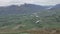 Paragliding activity take place on the hill. The background is Mount Remarkable