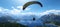 Paragliding adventure in the beautiful alps a bright summer day with lakes and aircraft
