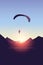 Paragliding adventure mountain landscape at sunset