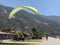 Paragliding against the backdrop of the mountains and the sea. Parachuting - paragliding. Skydiving on the background of the sky.