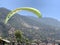 Paragliding against the backdrop of the mountains and the sea. Parachuting - paragliding. Skydiving on the background of the sky.