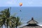 Paragliding athlete flies across the resort under the sunny weather