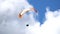 Paragliding in blue sky with clouds. Paraglider fly with parachute high and fast