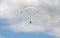 Paragliding concept. Wing parachute paragliders against the beautiful cloudy sky on a summer day. Summer extreme sports. Summer ou