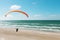 Paragliding on the deserted beach