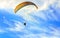 Paragliding extreme Sport with blue Sky and clouds on background