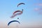 Paragliding flight show in a blue sky
