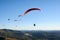 Paragliding flying over mountains