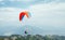 Paragliding with instructor using colorful paraglider over Pokhara town, Nepal. Active vacation concept image