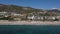 Paragliding landing on the beach is viewed from the sea