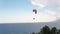 Paragliding Over Sea with View of Mountains And Green