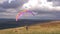 Paragliding pilot on high landscape waiting take off