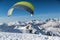 Paragliding from a Snow Covered Mountain Top