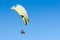 Paragliding sport flight on soaring wing in clear blue sky