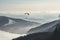 Paragliding sport parachute flying above the mist. Generate ai