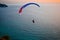 Paragliding during a summer sunset on the island of Lefkada in Greece