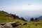 Paragliding under the valley in himalayan mountains