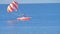 Paragliding using speed boat on blue sea waters on vacation 4k