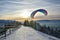 Paragliding in winter mountains