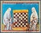 PARAGUAY - CIRCA 1980: A stamp printed in Paraguay shows Two women in robes, chess board, circa 1980.