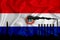 Paraguay flag, background with space for your logo - industrial 3D illustration.Silhouette of a chemical plant, oil refining, gas