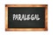 PARALEGAL text written on wooden frame school blackboard