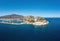 Paralio Astros port, Arcadia, Peloponnese, Greece. Aerial drone view of town, breakwater, boat, sea