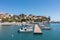 Paralio Astros port, Arcadia, Peloponnese, Greece. Aerial drone view of village, moored boat in sea