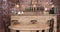 Parallax shot of an empty table and two chairs in front of a bar