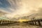 Parallel concrete piers on beach and sea wave