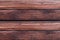 Parallel dark brown boards with lines natural pattern of weathered wood