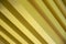 Parallel golden metallic bars, diagonal view