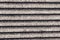 Parallel striped concrete wall of a bridge monochrome effect