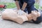 Paramedic demonstrates CPR on a dummy