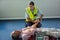 Paramedic examining a patient during cardiopulmonary resuscitation