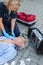 Paramedic examining unconscious patient